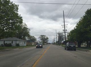A narrow corrugated median separates traffic on Mason Street past Cass Street.