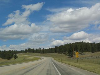 Upon entering the mountainous area, the highway begins to wind its way as it gains elevation.