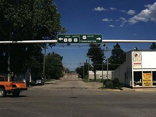 U.S. 18 and U.S. 20 (West 8th Street) eastbound reaches its junction with U.S. 85 (Cedar Street) in Lusk. The three U.S. routes turn north onto Cedar Street toward downtown Lusk. In addition to its status as a gateway to several regional attractions such as the Black Hills, Lusk is also home to the Wyoming Women"s Center, which functions as the state correctional facility for women. The main state correctional facility is located in Rawlins in Carbon County.