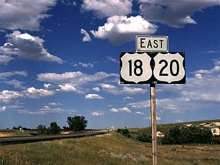These U.S. 18 and U.S. 20 east shields are found just west of Lusk as the braided route approaches the town. Lusk is the "Crossroads of the West." In addition to the U.S. highways (18, 20, 85), the Union Pacific Railroad passes through town. Both the Cheyenne and Black Hills Trail and Texas Trail ran through Lusk, and historical markers are posted along the routes of these trails. Recently (late 1990s/early 2000s), Lusk was the feature of news stories touting that the entire town is wired for the Internet.