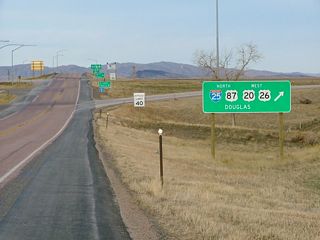 Signage for north Interstate 25/U.S. 87 and west U.S. 20-26 as seen from westbound U.S. 18-20 after the preceding ends signage at Orin Junction.