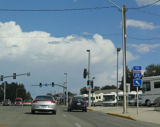 To Interstate 25, follow southbound Business Loop I-25/U.S. 87 Business and eastbound U.S. 20-26 Business along Yellowstone Highway. Note that the business route is heading northeast, even though signed as southbound.