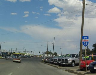 Business Loop I-25 is now signed as To Interstate 25. Now U.S. 20-26 Business-87 are not signed here either.  The business route is now traveling northwest toward a rendezvous with Interstate 25 at Exit 168.