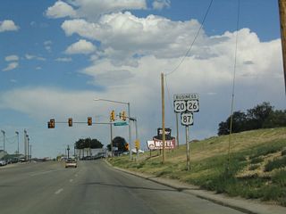 Now approaching McKinley Street, U.S. 20-26 Business-87 is again signed, but the Business Loop I-25 shield is missing.