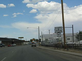 Another set of business route shields is posted along Yellowstone Highway as the business route passes between McKinley Street and Beverly Street.
