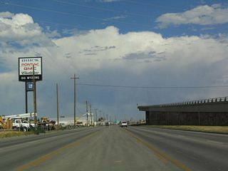 Car dealerships as well as industrial and equipment rentals line this stretch of U.S. 20-26-87 as the route slips away from the Interstate and its towering ramp.