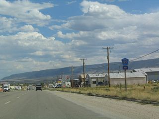 The old alignment of U.S. 20-26 is still known as Old Yellowstone Highway, and it is signed as Natrona County Route 127. From here, Natrona County Route 127 travels northwest via the Burlington Northern and Santa Fe Railroad. U.S. 20-26 Business, meanwhile, continue east toward Mills and Casper.