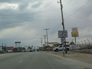 This is the first reassurance shield for westbound U.S. 20-26-87 along Yellowstone Highway. Now that the business route is south of Interstate 25, it moves away from the North Plate River corridor.