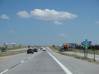 Interstate 25 and U.S. 87 north cross the state line at Colorado Milepost 299 / Wyoming Milepost 0.