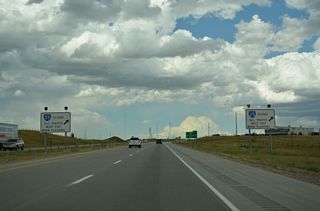 Another set of road closure signs precede Exit 2 along I-25/U.S. 87 northbound.