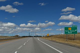 A diamond interchange joins I-25/U.S. 87 with WY-220 (Terry Bison Ranch Road) at Exit 2. The Terry Bison Ranch is a well known cattle and bison ranch located south of Cheyenne and west of I-25.