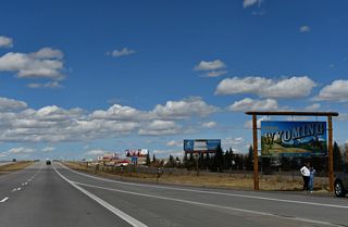 A small parking area was added next to the Wyoming welcome sign along I-25/U.S. 87 north by 2010. The turnout allows travelers to take pictures in front of the sign.