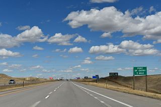 A port of entry / truck weigh station precedes Exit 7 along I-25/U.S. 87 northbound.