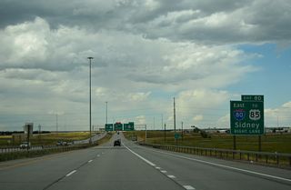 I-80 continues another 45 miles east across Laramie County, Wyoming to the Nebraska state line at Pine Bluffs. The freeway continues to Kimball and Sidney and across the Cornhusker State to Omaha.
This sign was removed by 2025.