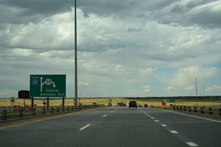 A folded diamond interchange links I-25/U.S. 87 with U.S. 30/Business Loop I-80 (Lincolnway) at Exit 9.