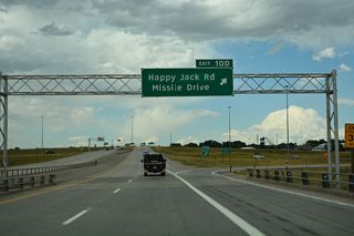 The exchange at Exit 10 was formerly a cloverleaf interchange, only the second in the entire state. Three of the four loop ramps were removed, but the odd exit suffix convention remains with the lone off-ramp from I-25 northbound as Exit 10 D.