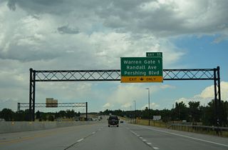 Pershing Boulevard branches east from Randall Avenue and I-25/U.S. 87 across Cheyenne to Lincolnway. Randall Avenue leads to F.E. Warren AFB Gate 1; Gate 2 is along Missile Drive west from Exit 10 D.
