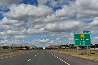 WY-211 (Horse Creek Road) stems west from parallel WY-219 (Yellowstone Road) to the diamond interchange at Exit 16. 