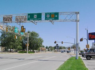 U.S. 26 continues straight ahead, following the Oregon Trail corridor east toward Scottsbluff and Ogallala. U.S. 85/CanAm Highway turns south onto Main Street, traveling toward Cheyenne, the capital city. Turn left onto Main Street northbound to enter Torrington&#039;s historic downtown area.