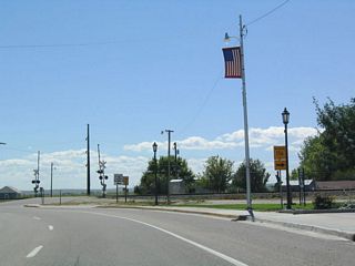 As the U.S. highway approaches the Burlington Northern and Santa Fe Railroad crossing, Wyoming 156 prepares to split to the south. Wyoming 156 connects to Wyoming 157 and then crosses the North Platte River to London Flats. Both Wyoming 156 and Wyoming 157 might be old alignments of U.S. 26-85.