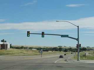After the Pershing Boulevard intersection, U.S. 30 widens out to four lanes with a median barrier. In some maps that date to the early 1960s, there may have been plans for Interstate 80 to follow Lincolnway from here east to Archer. However, the freeway was ultimately routed to the south on a new alignment, and U.S. 30 was left to remain on its original route. The divided highway remains as evidence of this earlier plan for Interstate 80.