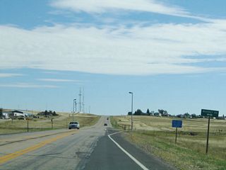 Now a two-lane highway, Lincolnway (U.S. 30) approaches Whitney Road.