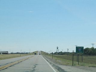 A few miles further east, U.S. 30/Lincolnway approaches its junction with Interstate 80. Use Interstate 80 west to return to Cheyenne; follow Interstate 80 east to continue east on signed U.S. 30. A service road on the north side of the freeway will continue as the old alignment of U.S. 30