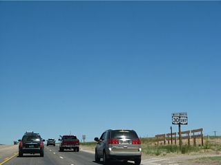 Westbound U.S. 30 and northbound U.S. 287 leave Laramie along Third Street and proceed as a five-lane highway en route to Bosler.