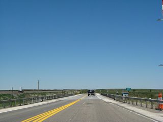 The Laramie River, which has generally followed U.S. 30-287 from Laramie north to this point, crosses the highway and continues north toward the Wheatland reservoirs, then curves east to pass through the Laramie Mountains en route to an eventual rendezvous with the North Platte River.