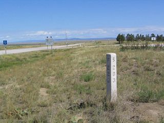 This monument sign is located in the "front yard" of the Mule Creek Junction Rest Area at the intersection of U.S. 85 and U.S. 18. The F-229 and S-203 likely refer to the federal aid primary designations of the two routes.