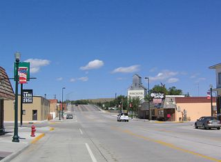 In Lusk, this view is afforded along northbound U.S. 18-85 (Cedar Street) after U.S. 20 follows East Third Street east toward Nebraska. Ahead, U.S. 18-85 cross over the Union Pacific (Chicago and Northwestern) Railroad on a viaduct.