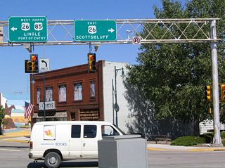 Northbound Business U.S. 85 reaches its junction with U.S. 26. Established in 1926, U.S. 26 was originally intended to connect U.S. 30 in Ogallala, Nebraska, with U.S. 185 (now U.S. 87) west of Guernsey. With a major expansion across Wyoming in 1950 and to near Idaho Falls in 1951, U.S. 26 was fully extended to Seaside, Oregon, in 1952 (with an overlap with U.S. 101 north to Astoria). Aside from a retraction of the western end from Astoria to Seaside in 2004, U.S. 26 has remained unchanged ever since.