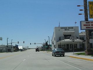 U.S. 18-20 turn west toward Orin Junction, where the routes meet Interstate 25 and U.S. 26-87. U.S. 18 ends at this junction; U.S. 20 joins Interstate 25 northbound en route to Douglas, Glenrock, and Casper.
