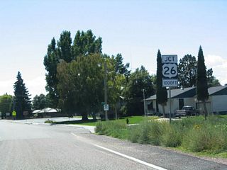 While the advance signage for U.S. 26 is in the sagebrush, the irrigated lawns of Lingle lay only a short distance south. U.S. 85 becomes Main Street, while U.S. 26 west follows West Fourth Street toward Guernsey.