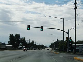 After Fox Farm Road, southbound Business Loop I-25 and U.S. 85-87B follow a five-lane alignment along Greeley Highway.