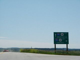 Sand Creek Road stems south from Old Highway 14 near Beulah into the diamond interchange with I-90/U.S. 14 at Exit 205.
