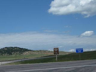 Discovered when the Interstate 90 freeway was being constructed in the early 1970s, the Vore Buffalo Jump is "a natural sinkhole that was used as a bison trap from about 1500 to 1800 A.D. Buffalo were driven over the edge of the sink hole as a method for the Native American tribes to procure the large quantities of meat and hides needed to survive the harsh prairie winters." Students and scholars frequent the site to excavate old bones and continue to find the remains of animals. A visitors center and excavation site building (opened in July 2011) are available on site for visitors for a nominal fee.
