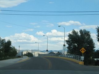 An unsigned route, WY-74 lines E Bridge Avenue for 0.22 miles between WY-130 (1st Street) and NE/SE River Street in the town of Saratoga. The state maintains the bridge across the North Platte River and approach streets.