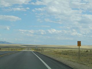 After leaving Walcott Junction, this is the first reassurance shield along southbound (eastbound) Wyoming 130. We'll have to revisit this area to get a picture that shows both Wyoming 130 and Wyoming 230. The state highway will continue south through Saratoga, then turn east at the Wyoming 230 junction eight miles south of Saratoga.