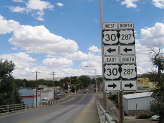This shield assembly omits the business loop, but it points the way to north/southbound U.S. 30-287. To the south, U.S. 30-287 travel together for several blocks, then divide at Grand Avenue. Grand Avenue heads east toward the University of Wyoming, while Third Street carries U.S. 287 south out of town and toward Fort Collins, Colorado.