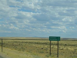 After departing from Interstate 80 and U.S. 30-287, the first mileage sign on southbound (eastbound) Wyoming 130-230 is for the towns of Saratoga and Encampment. Wyoming 130 and Wyoming 230 pass through Saratoga; Wyoming 130 will turns sharply east to cross the top of the Snowy Range, while Wyoming 230 travels south to Encampment. Wyoming 130 used to have this segment all to itself; it was given the added Wyoming 230 designation in 2013 and is shown co-signed on the 2014 official state map.