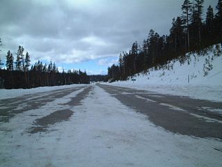 During the winter months, Wyoming 130 ends at this point. The road is wide to accommodate parking for day use snowmobiler and skiers.