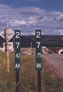 Wyoming 130 ahead-back milepost equation markers located near Centennial.