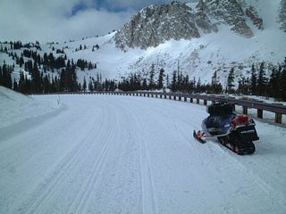The highway is well traveled during winter, even though the road is ostensibly closed. Snowmobiles can travel the highway, as seen in this winter photograph.