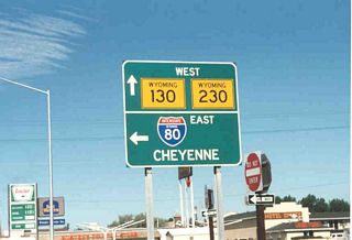 Westbound Wyoming 130 and Wyoming 230 reach their junction with Interstate 80 in West Laramie. At this interchange, Interstate 80 travels north-south in order to bypass Laramie.