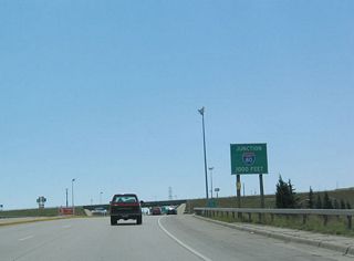 Southbound Interstate 180 approaches its junction with Interstate 80 after the Fifth Street traffic signal. There is no connection from Interstate 180 to First Street, which passes under Interstate 180/Central Avenue near the bridge over Crow Creek.