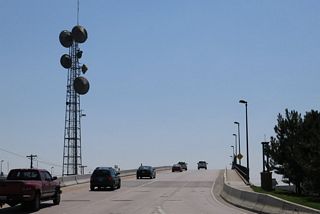 Interstate 180 begins its southbound journey alongside Business Loop I-25, U.S. 85, and Business U.S. 87 after the intersection with Lincolnway (U.S. 30 and Business Loop I-80).
