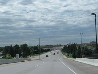 Interstate 180 descends from the Union Pacific Railroad viaduct.