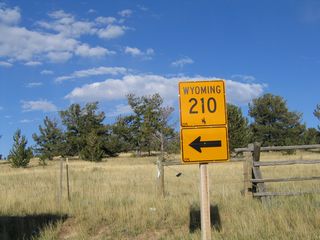 This Wyoming 210 trailblazer route marker is located near the Interstate 80 and U.S. 30 Summit Rest Area (Exit 323). It points the way to Happy Jack Road east to Curt Gowdy State Park and Cheyenne.