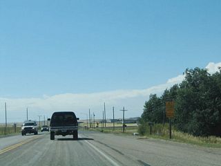 Westbound Wyoming 210/Happy Jack Road approaches Wyoming 222, Roundtop Road. The state highway travels south to Wyoming 225, Otto Road and north to Warren Air Force Base.